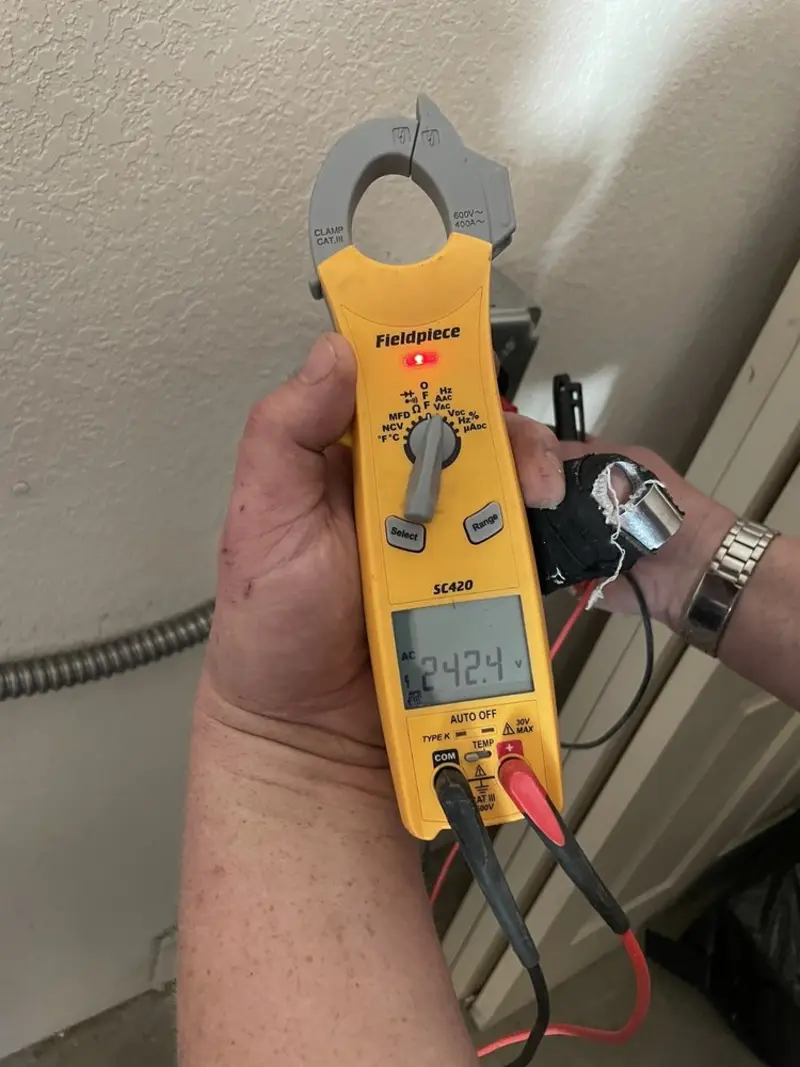 Voltage testing with clamp meter during Generator Installation in El Dorado Springs